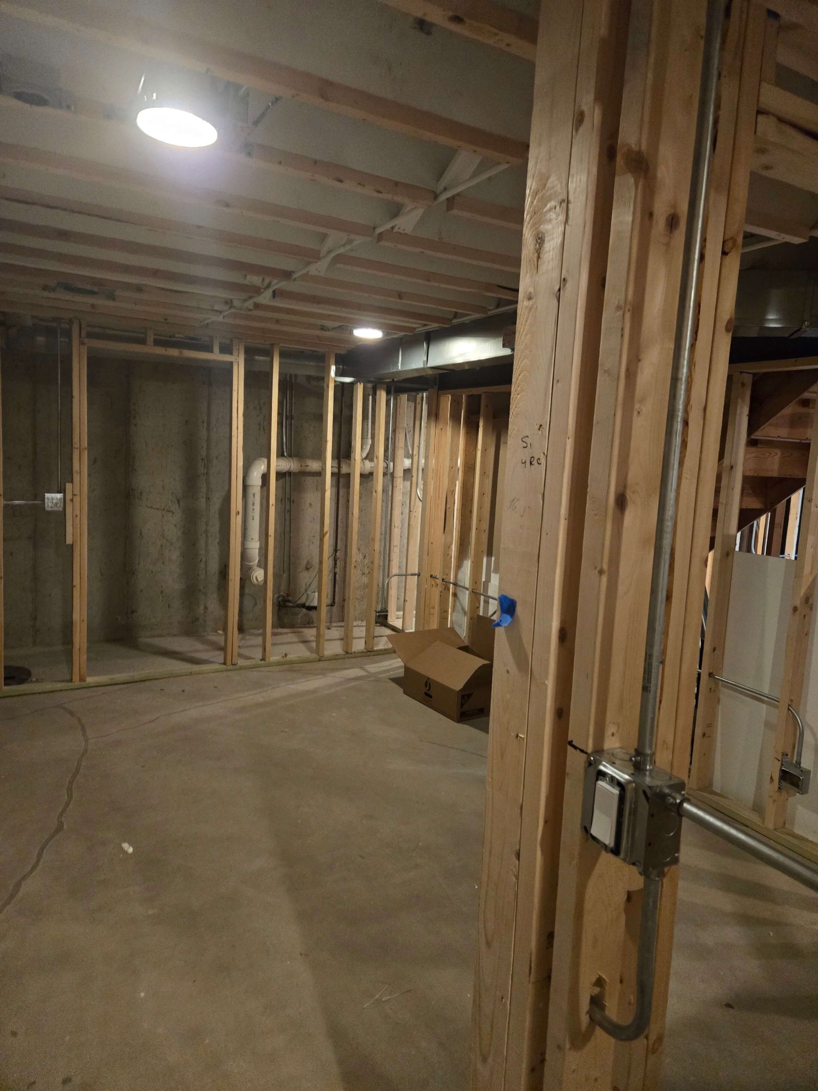 Basement framing and plumbing rough-in progress